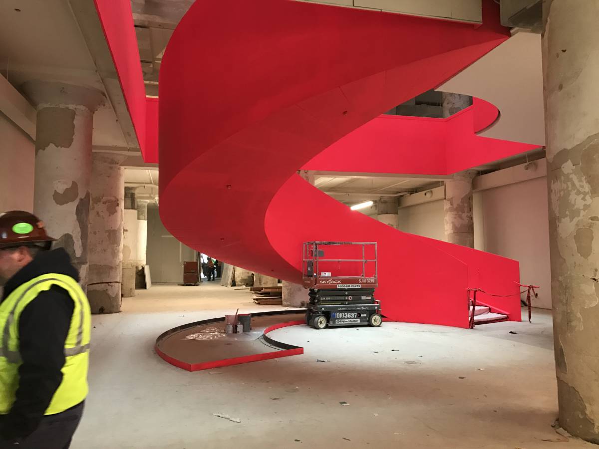 fluorescent coral staircase at Crosstown Concourse